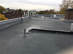 Liquid Rubber waterproofing system with a grey granite finish on a residential block in Camden with a 15 year warranty
